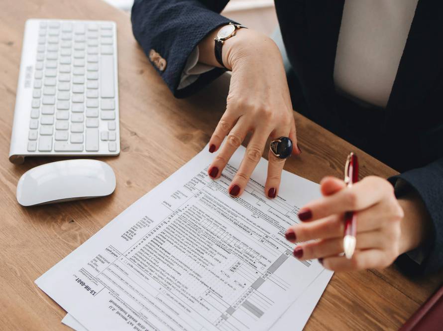 Image of an e-commerce Business owner reviewing her financial data including sales, and profit to avoid accounting and tax mistakes