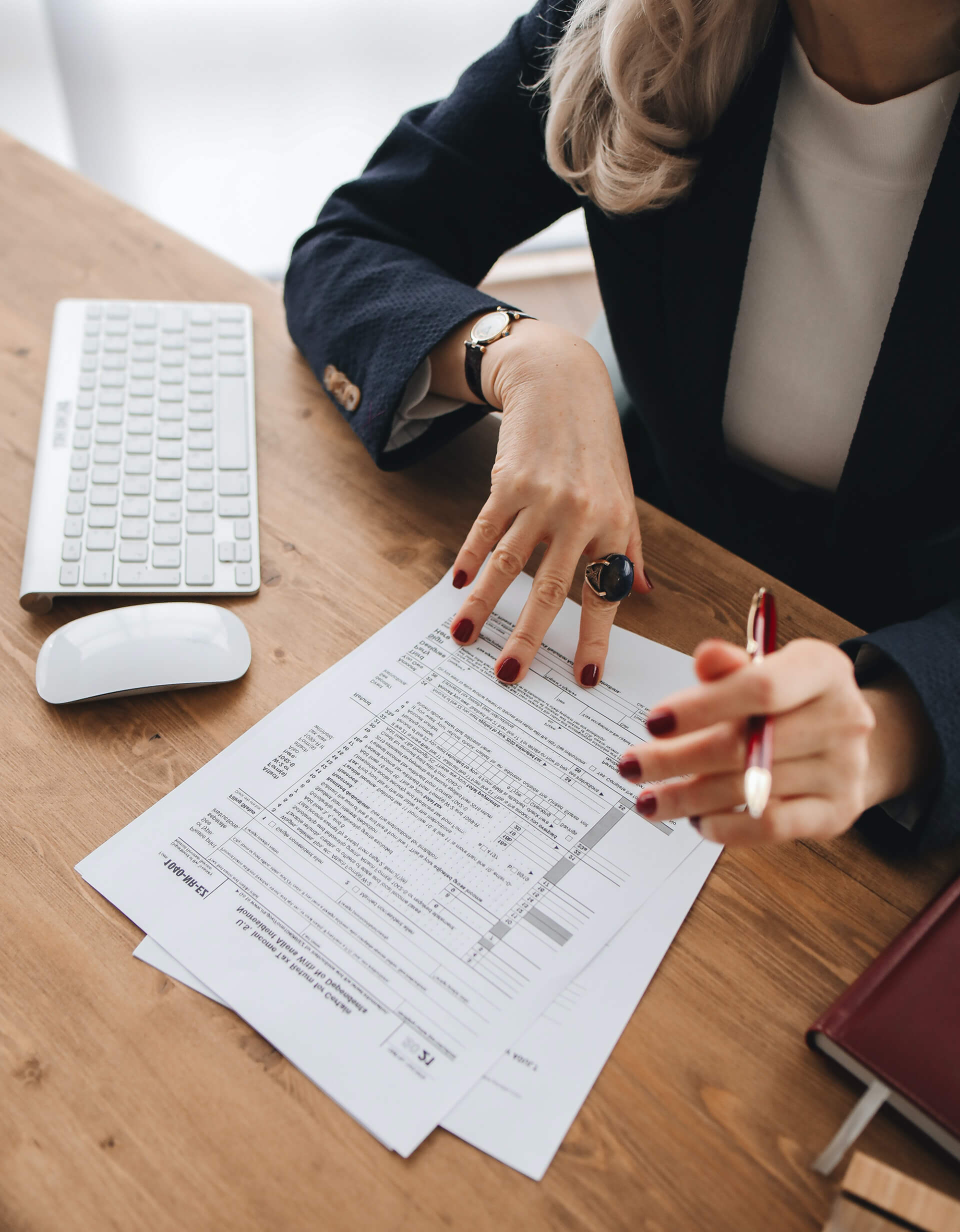 Image of an e-commerce Business owner reviewing her financial data including sales, and profit to avoid accounting and tax mistakes